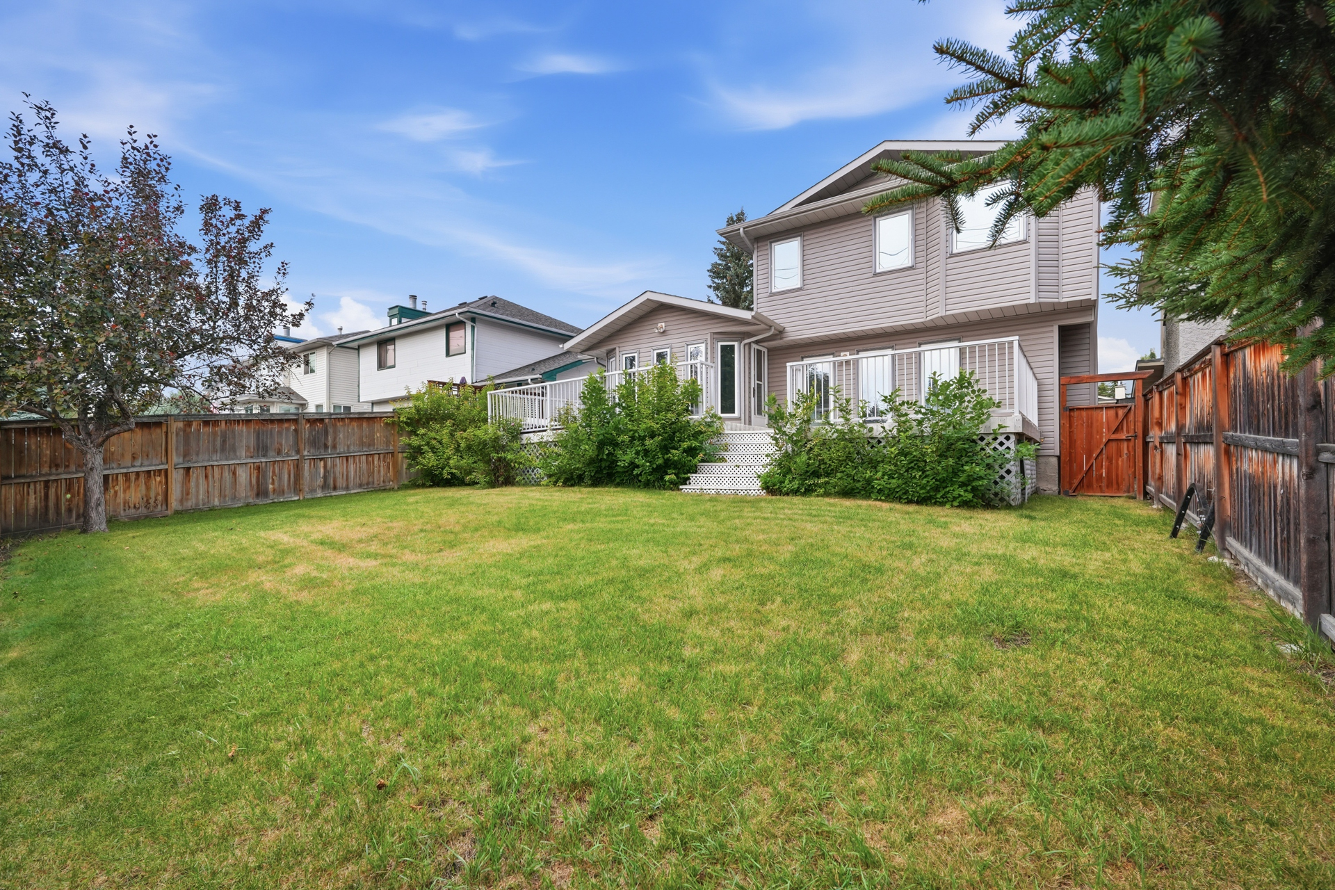 Fenced and landscaped backyard