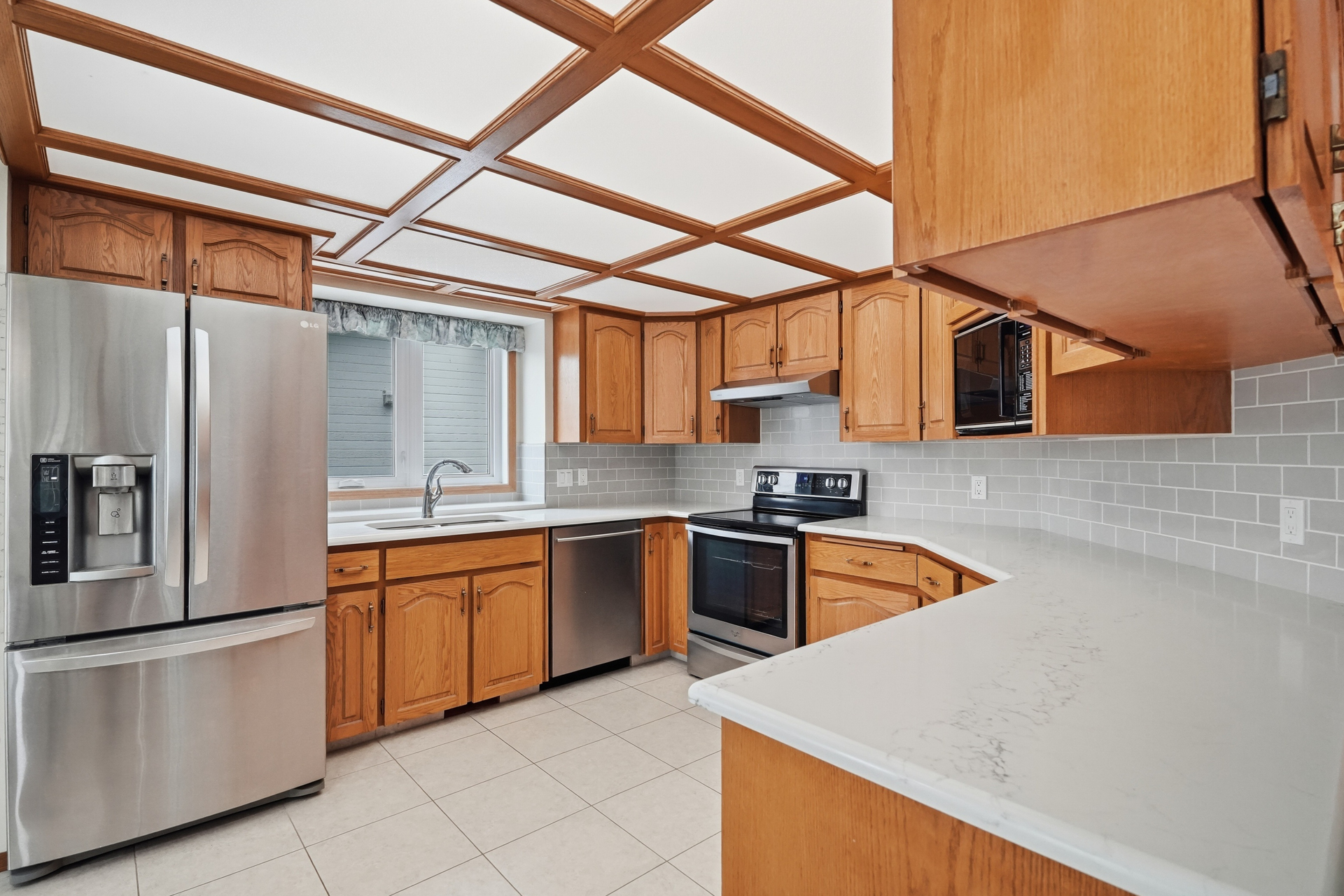 Kitchen with generous cabinetry and stainless steel appliances